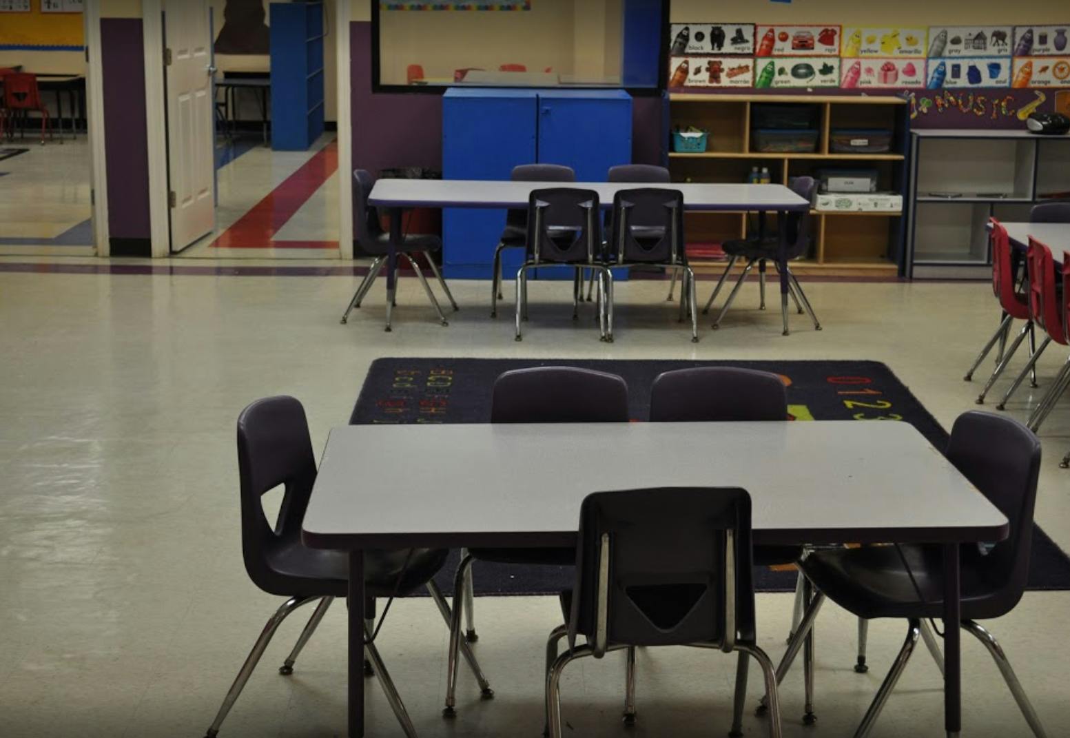 Empty classroom with tables and chairs