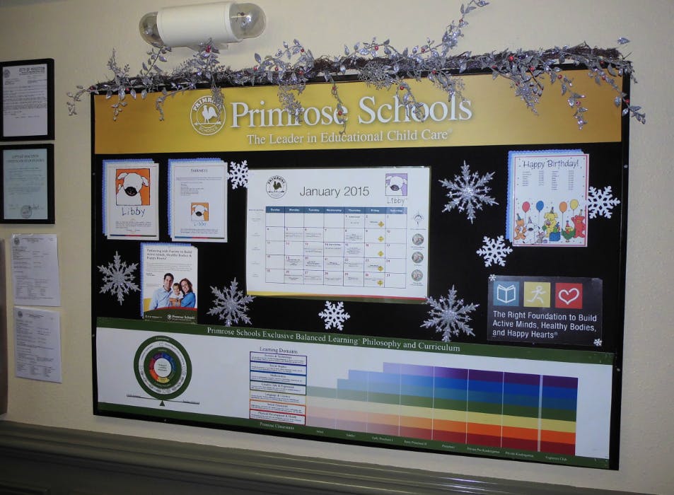 Primrose Schools bulletin board with calendar and information