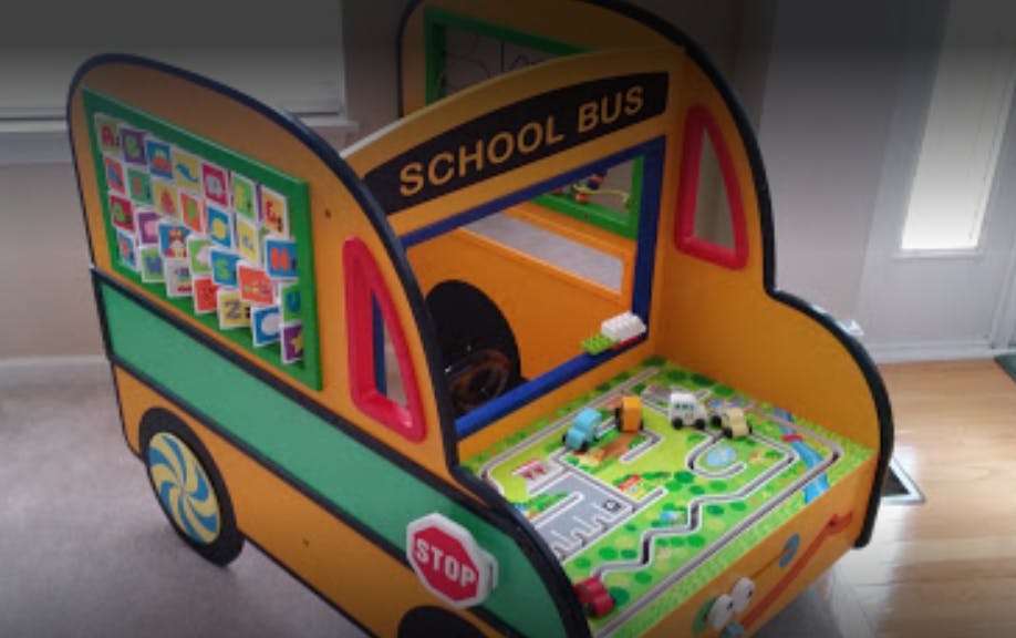 School bus play table with toy cars