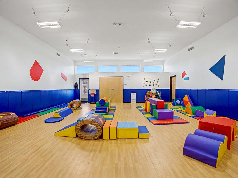Indoor playroom with colorful soft play equipment