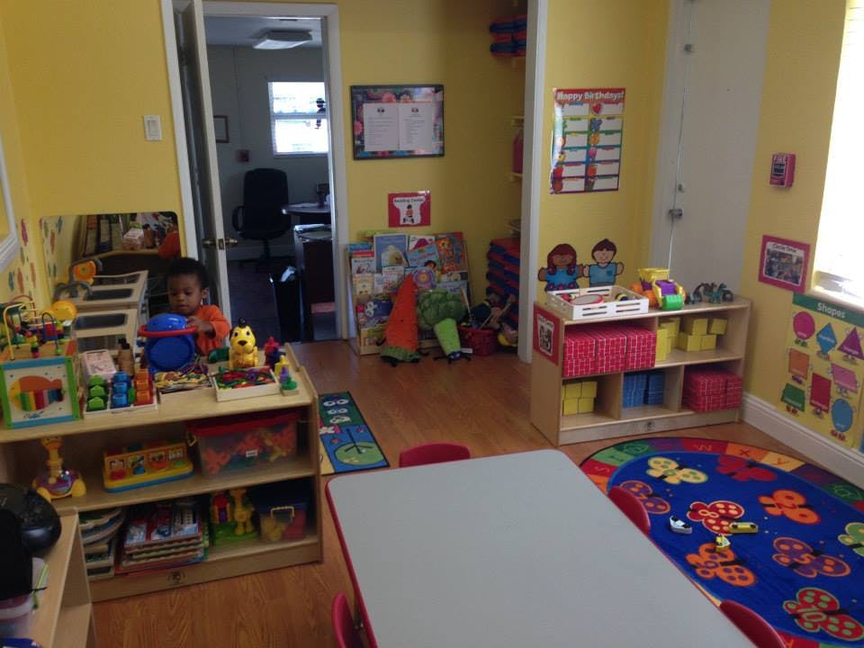 Child playing with toys in a classroom