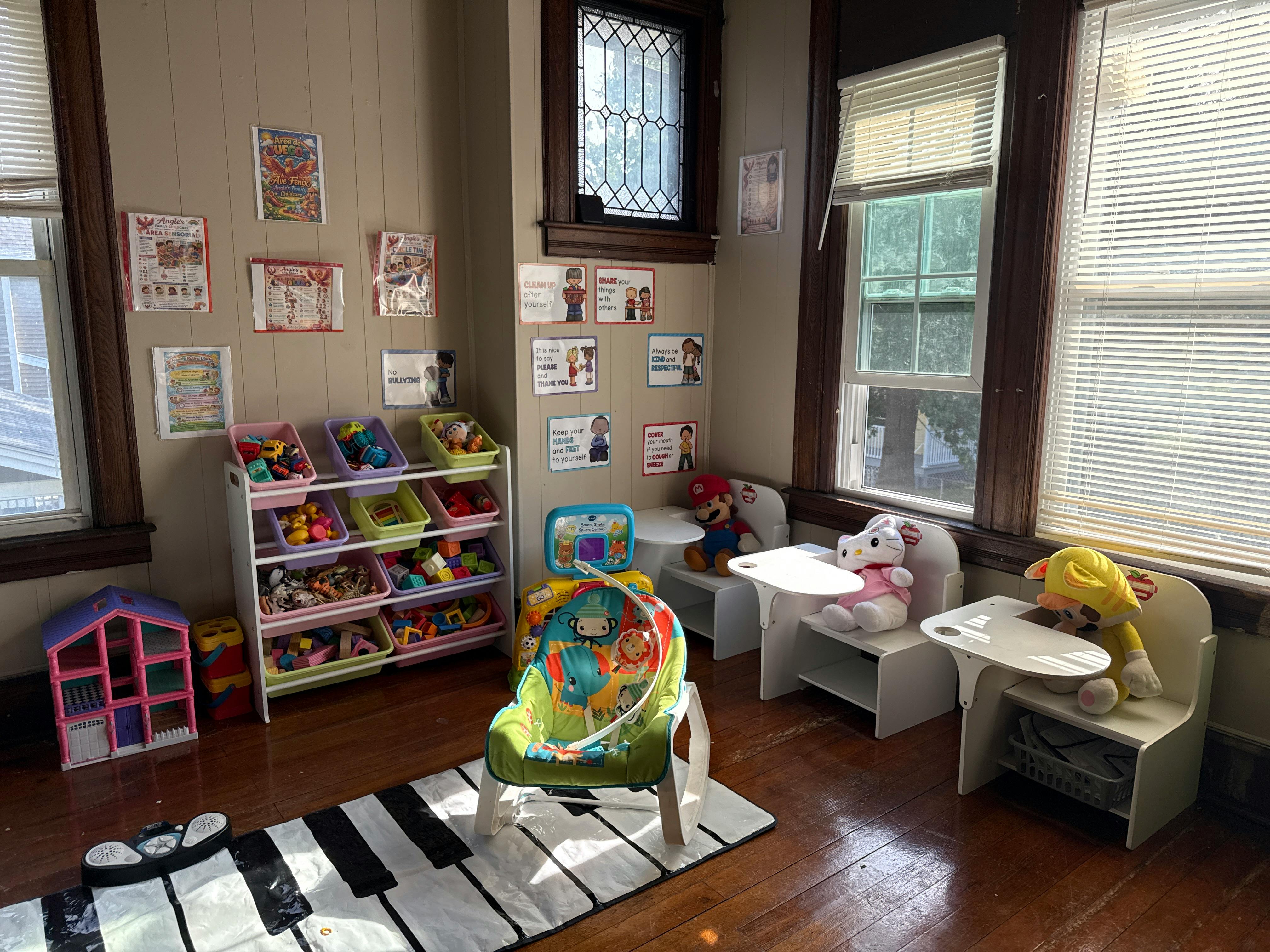 Childcare room with toy storage, small chairs with plush toys, and activity gear