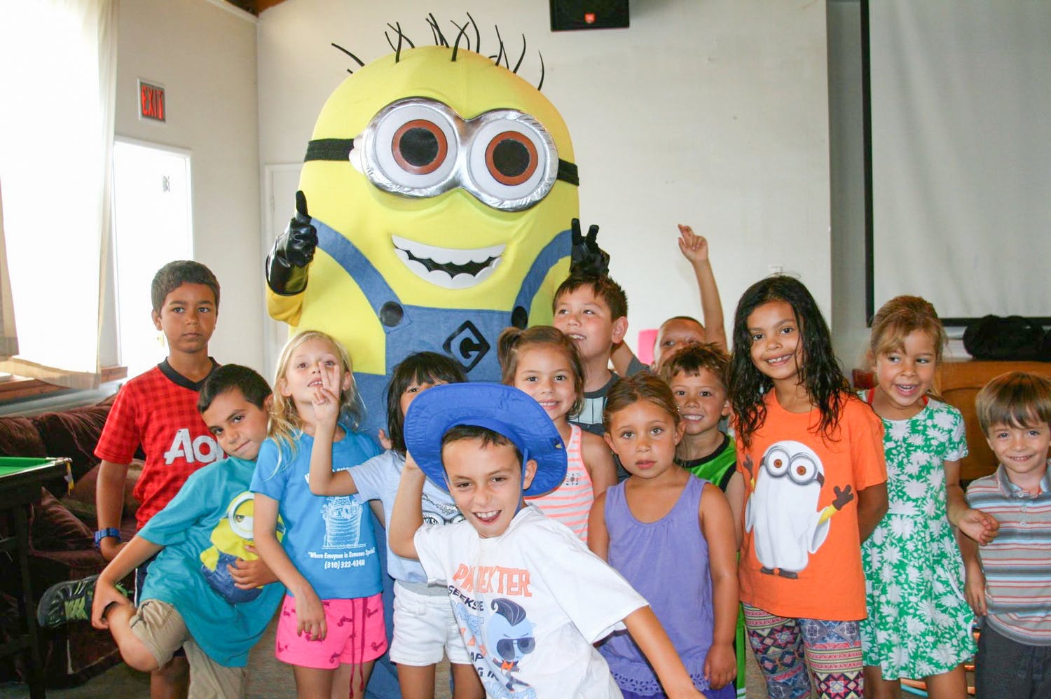 Minion character with a group of children