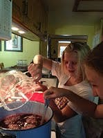 Two children cooking in a kitchen
