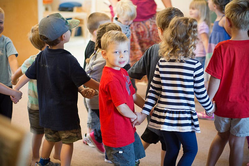 Children holding hands in a circle