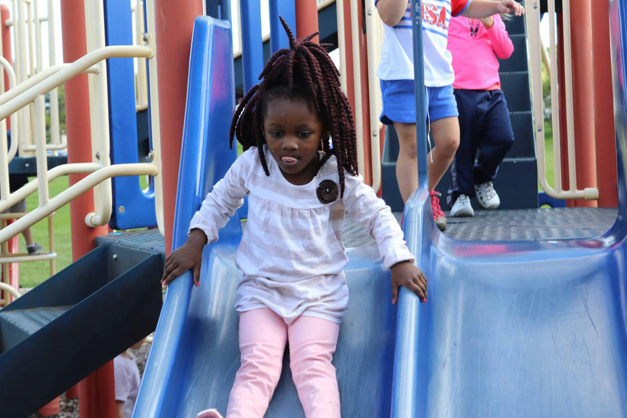 Child on a playground slide