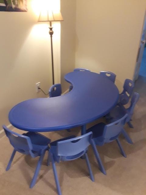 Blue kidney-shaped table with matching chairs