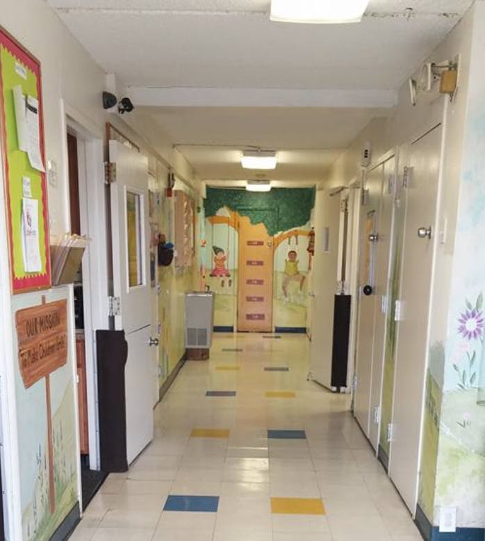 Hallway with doors and colorful murals on the walls