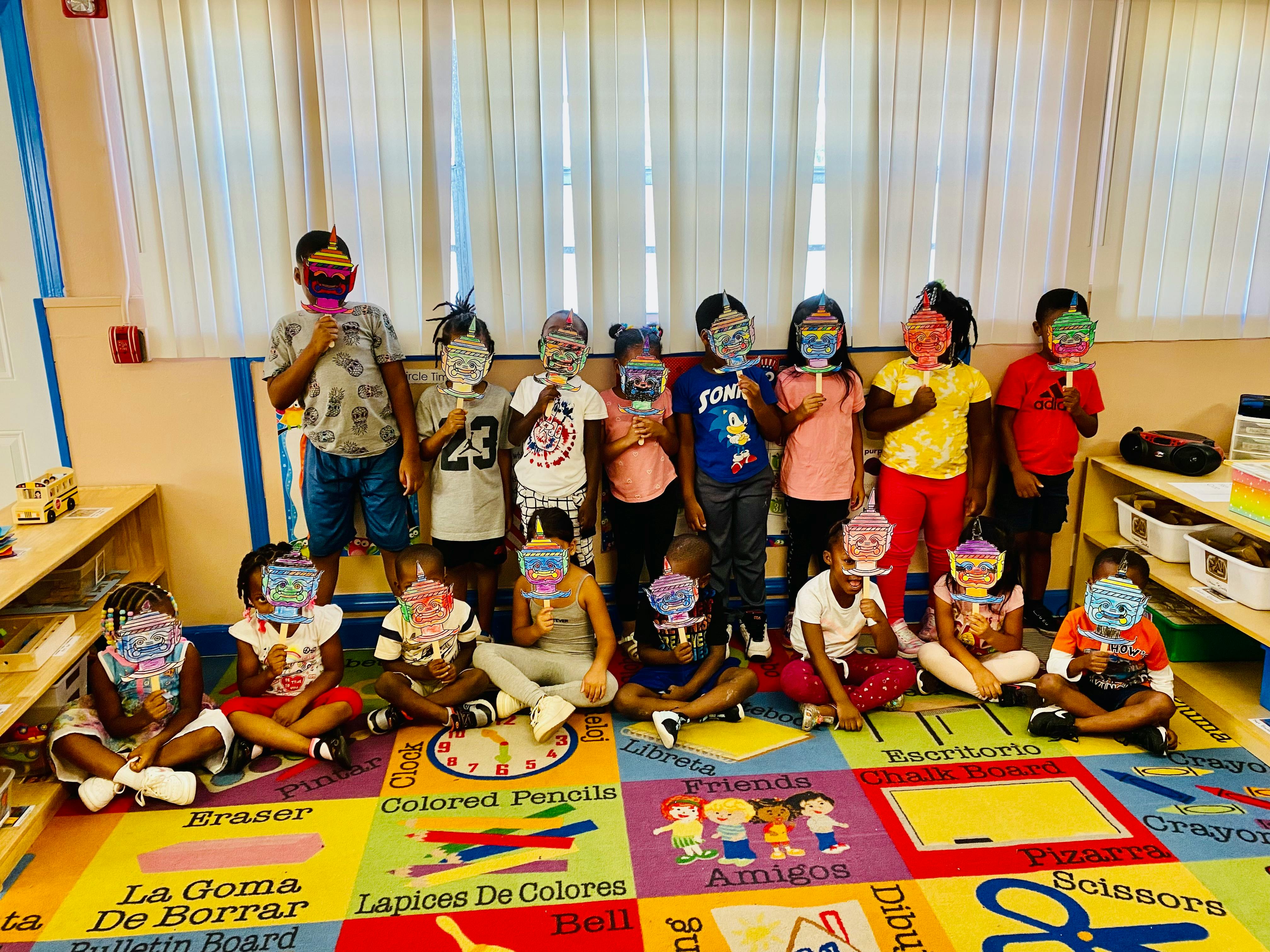 Group of children in a classroom, some wearing masks