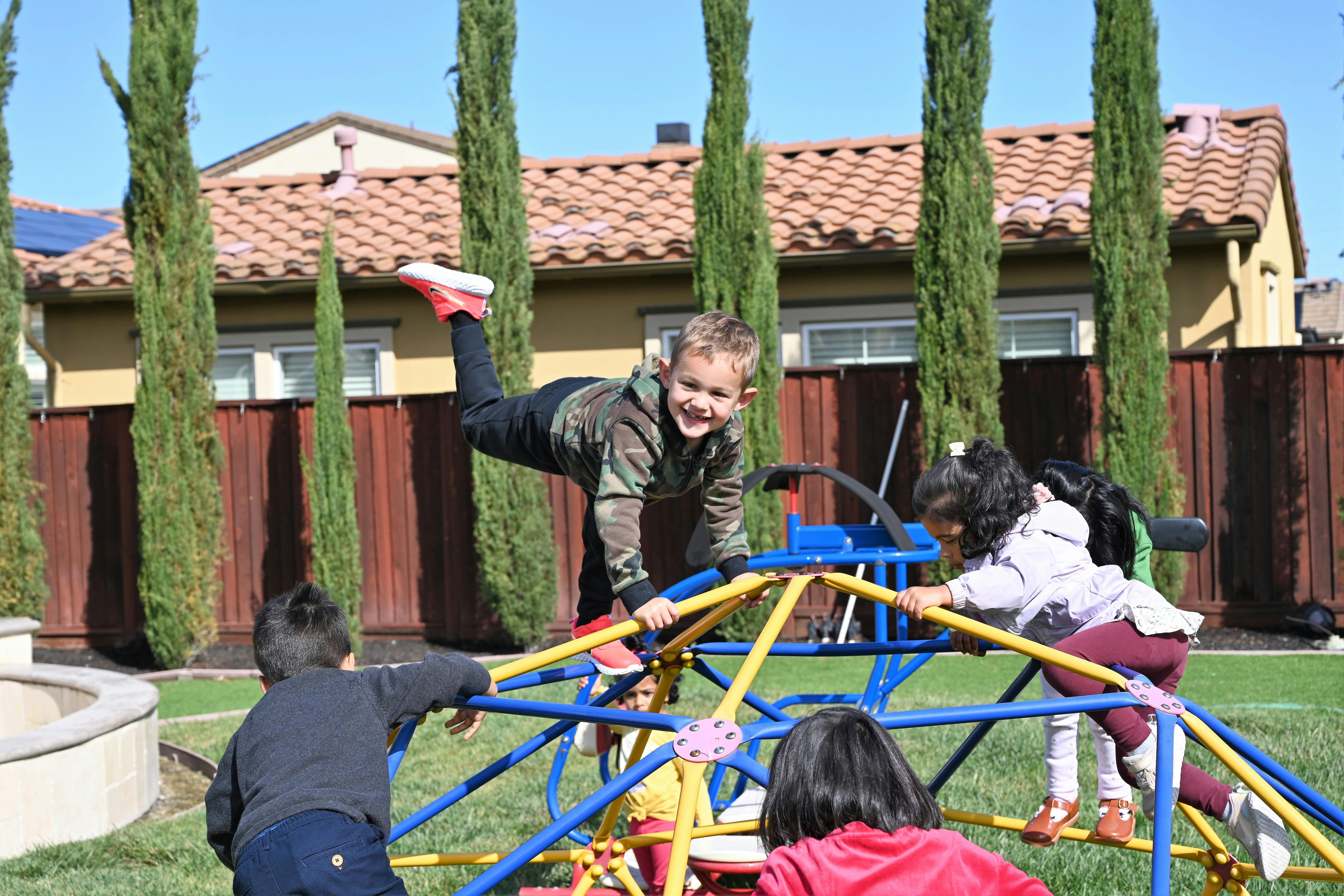 Children playing on a jungle gym outdoors