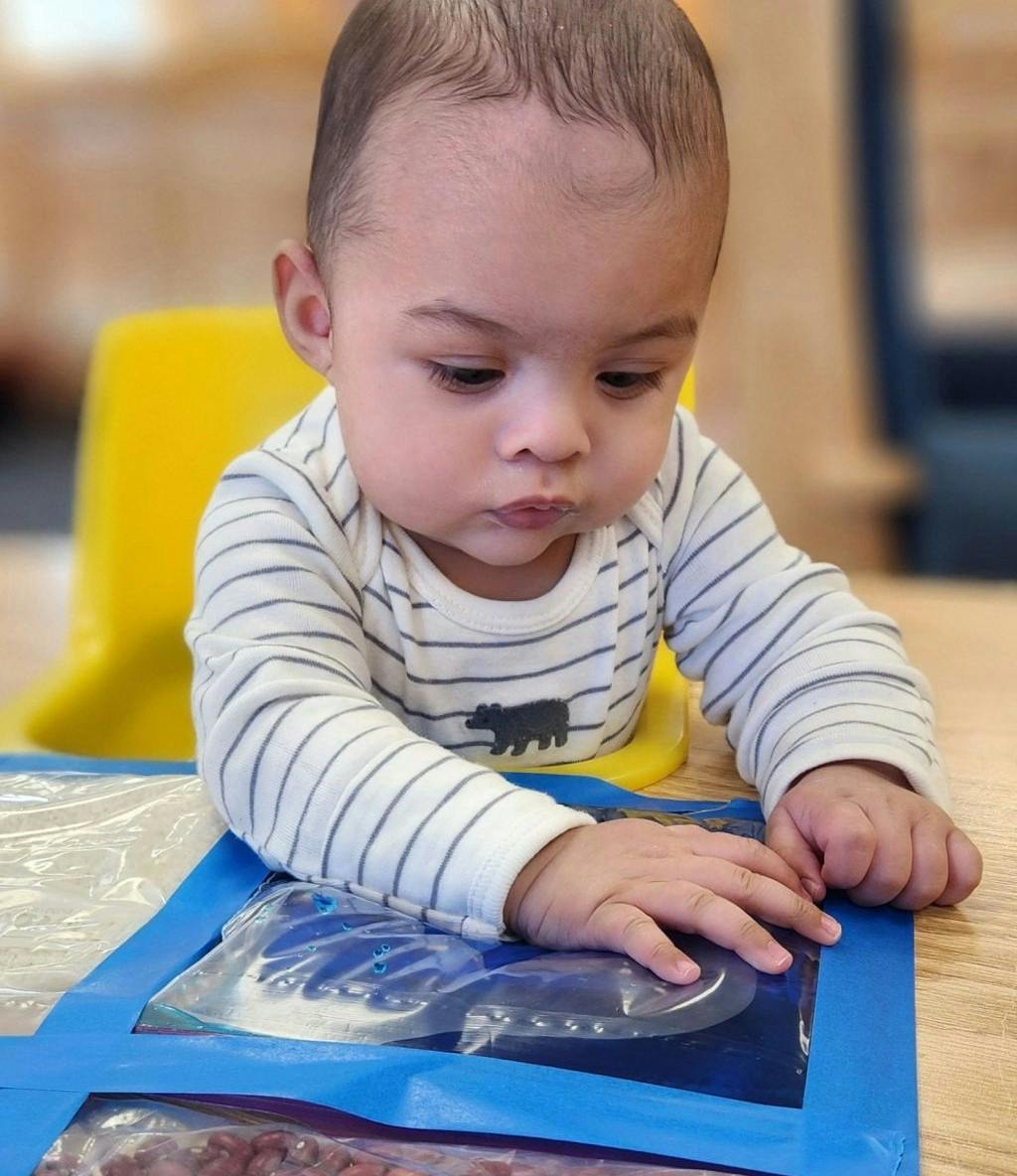Child playing with a sensory bag