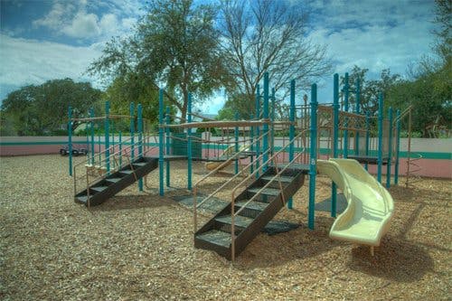 Playground structure with stairs and a slide