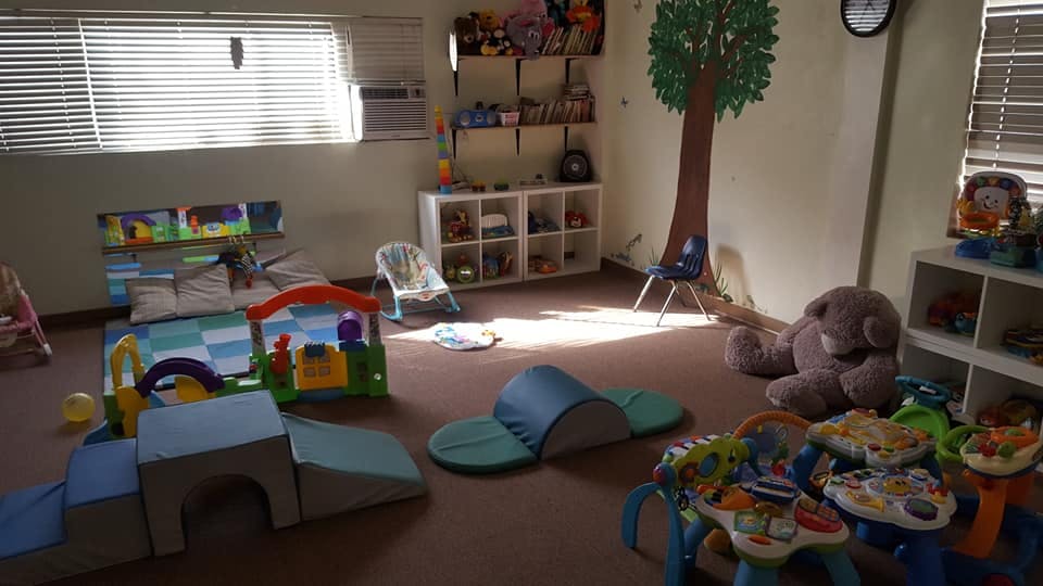 Playroom with soft play equipment and toys