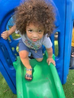 Child on a playground slide