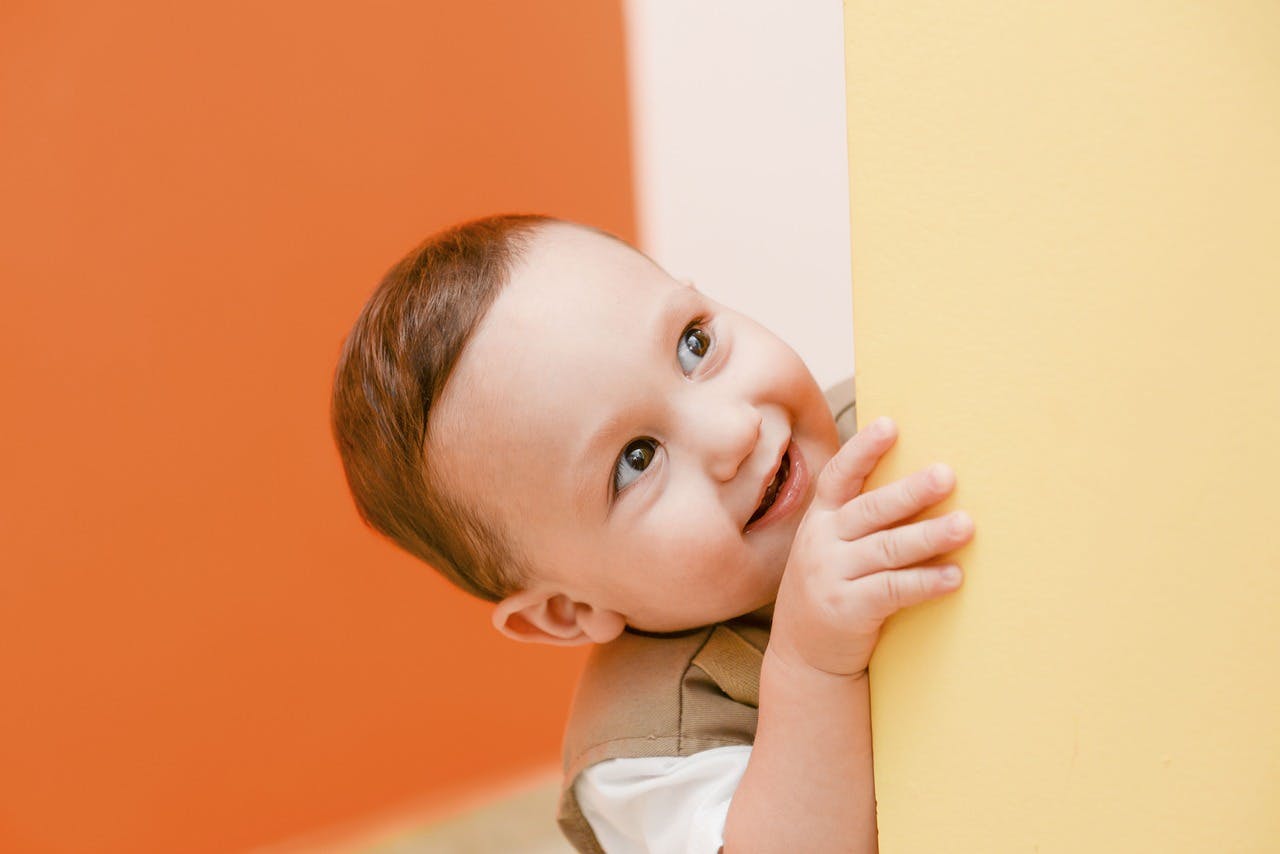 Child peeking around a corner