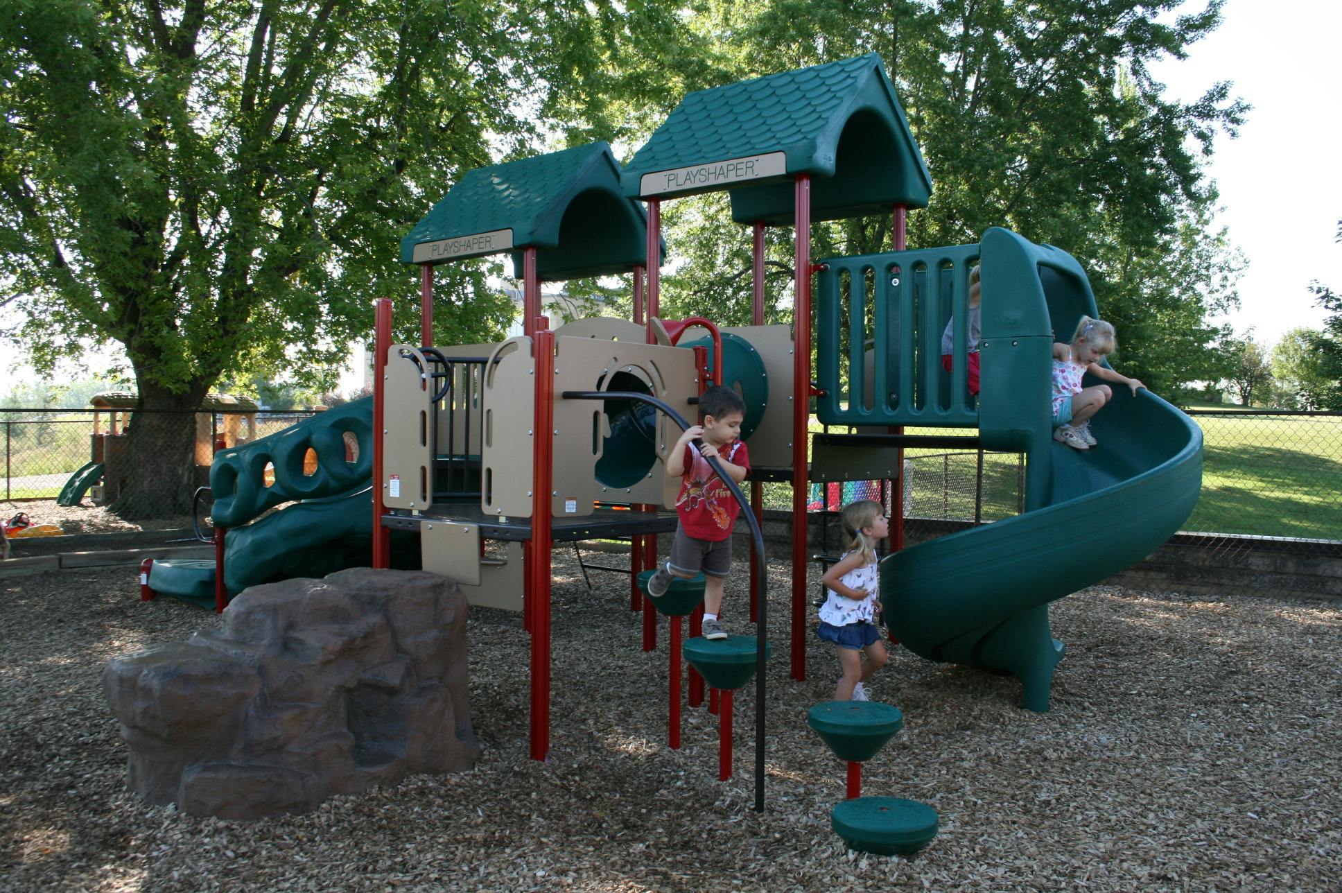 Children playing on a playground structure
