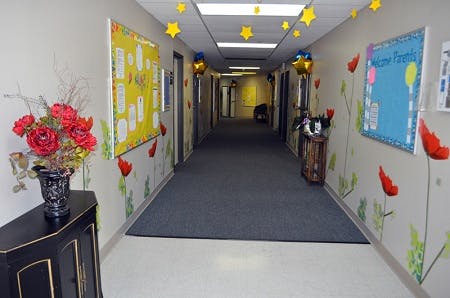 Hallway decorated with stars, flowers, and bulletin boards