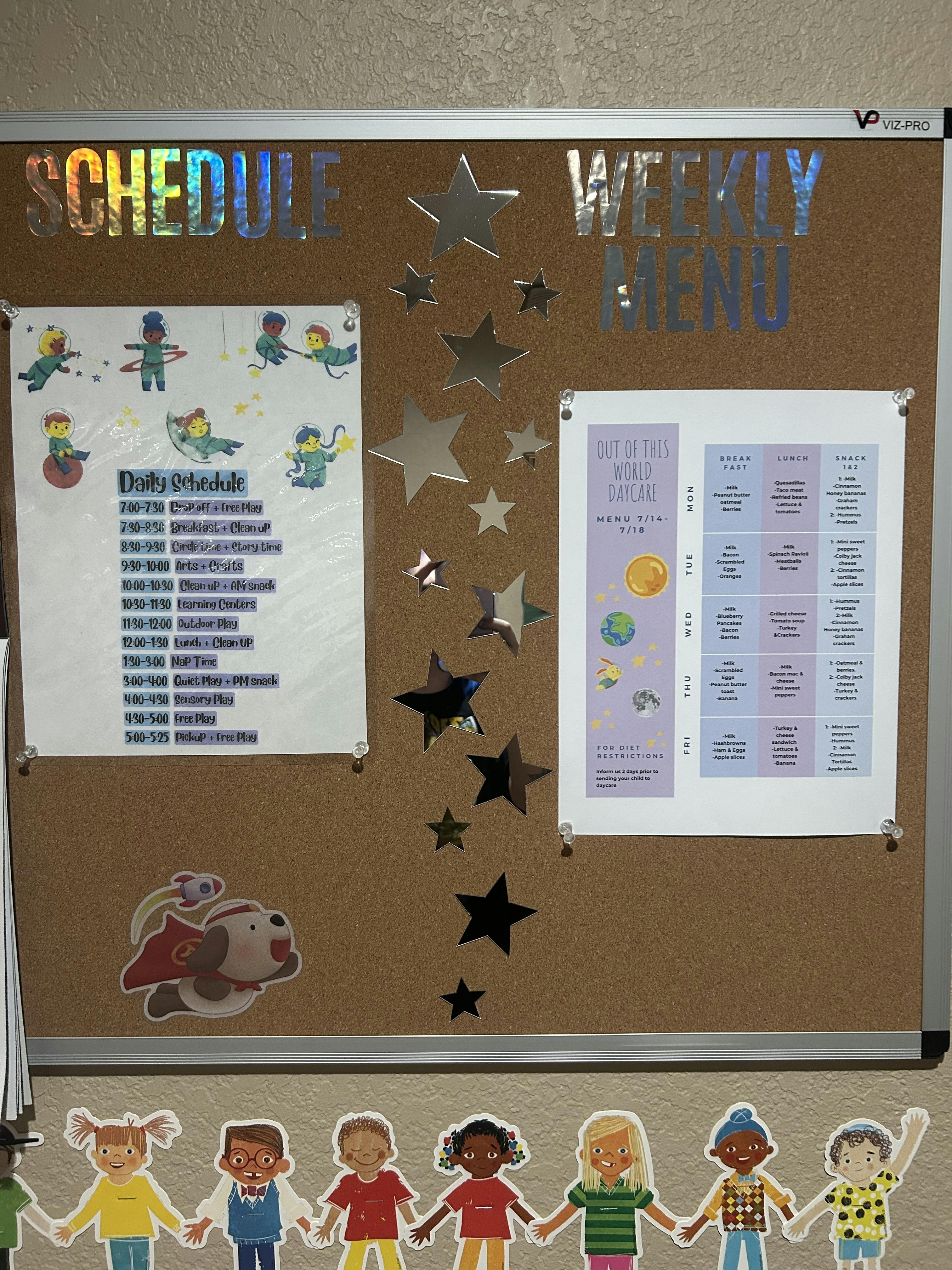 Cork board with a schedule, weekly menu, and star decorations