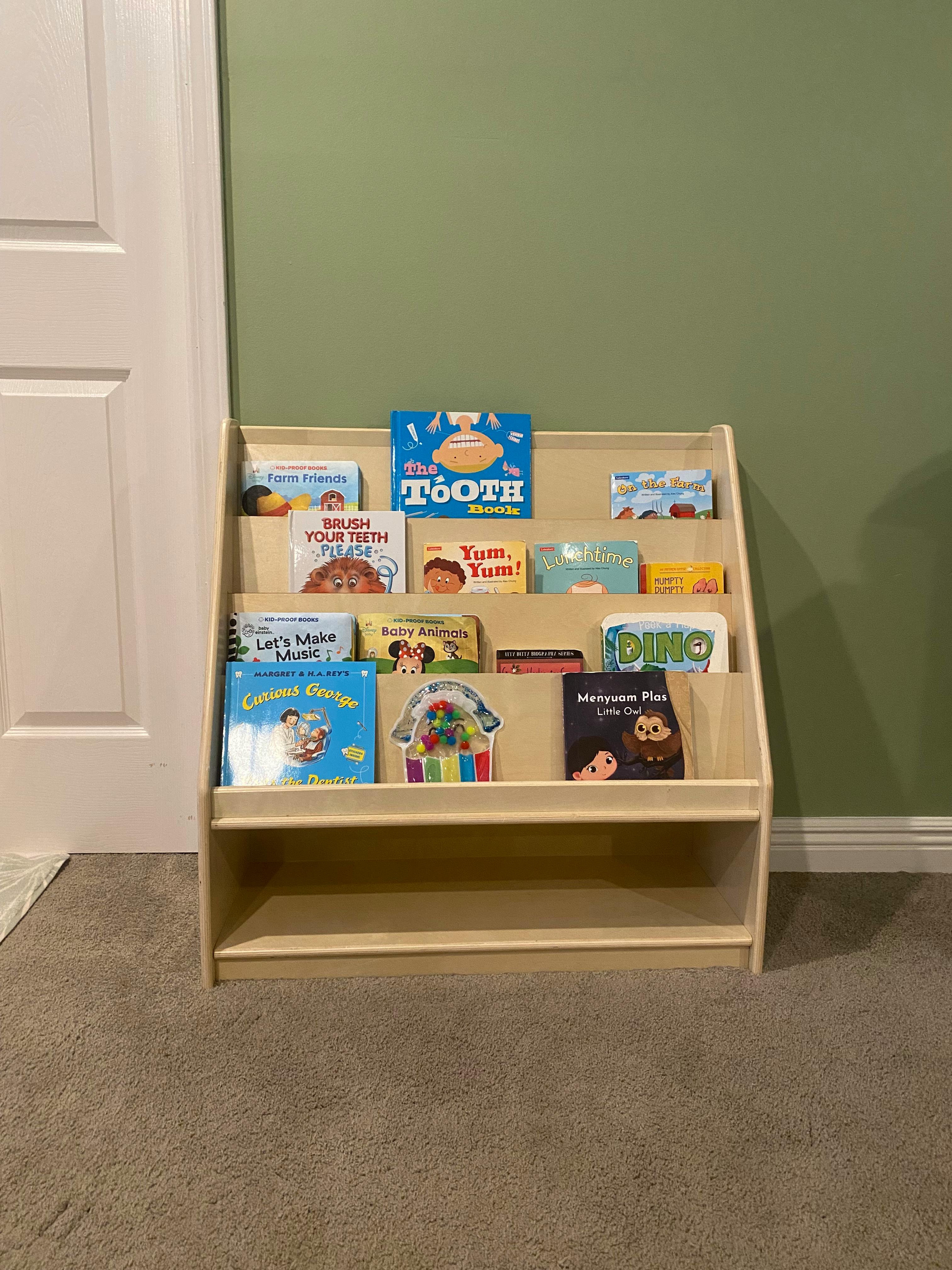 Wooden bookshelf filled with children's books