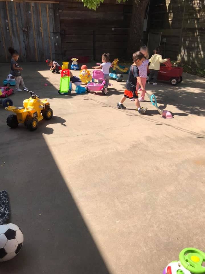 Children playing with toys outdoors