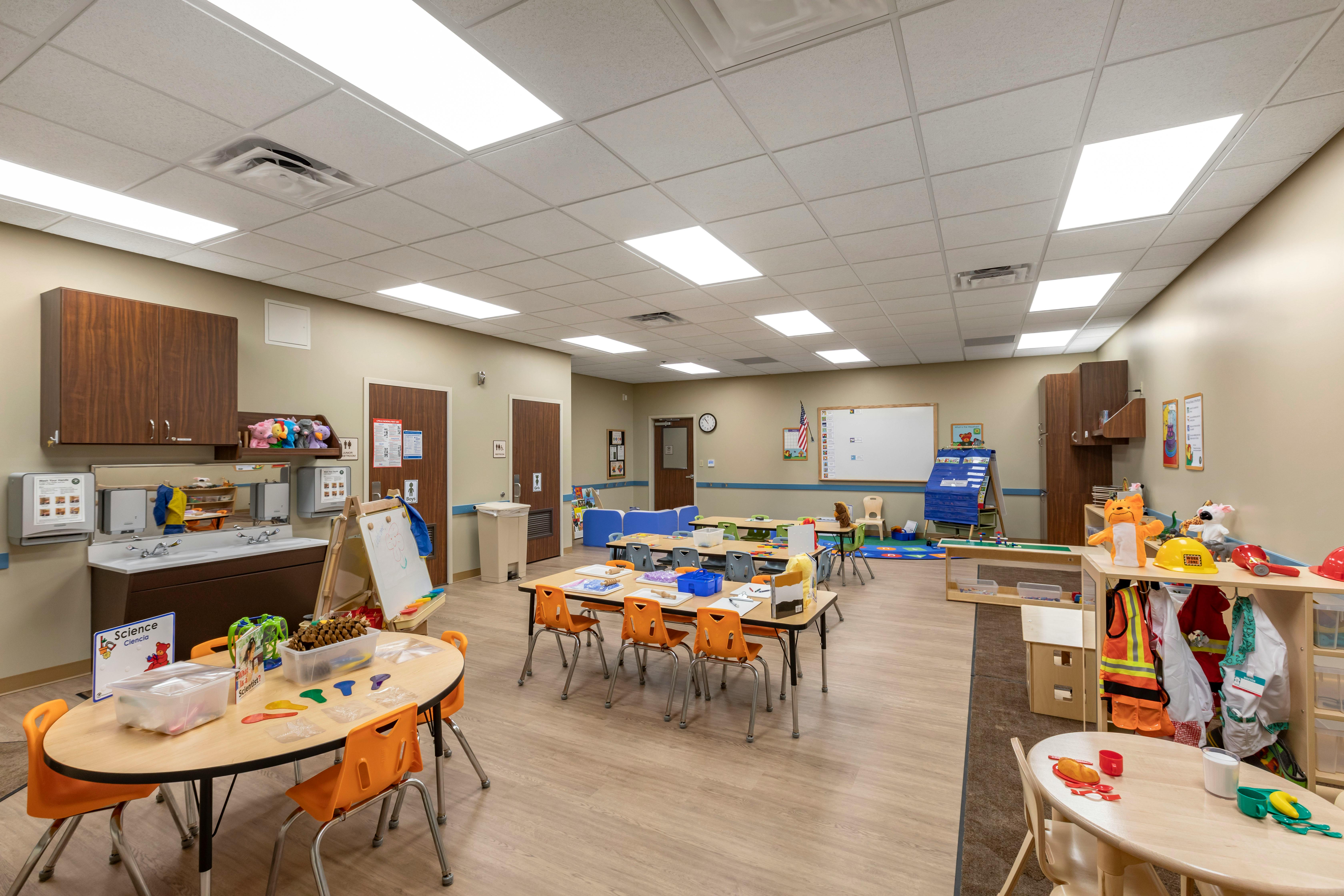 An empty early childhood classroom with multiple activity stations