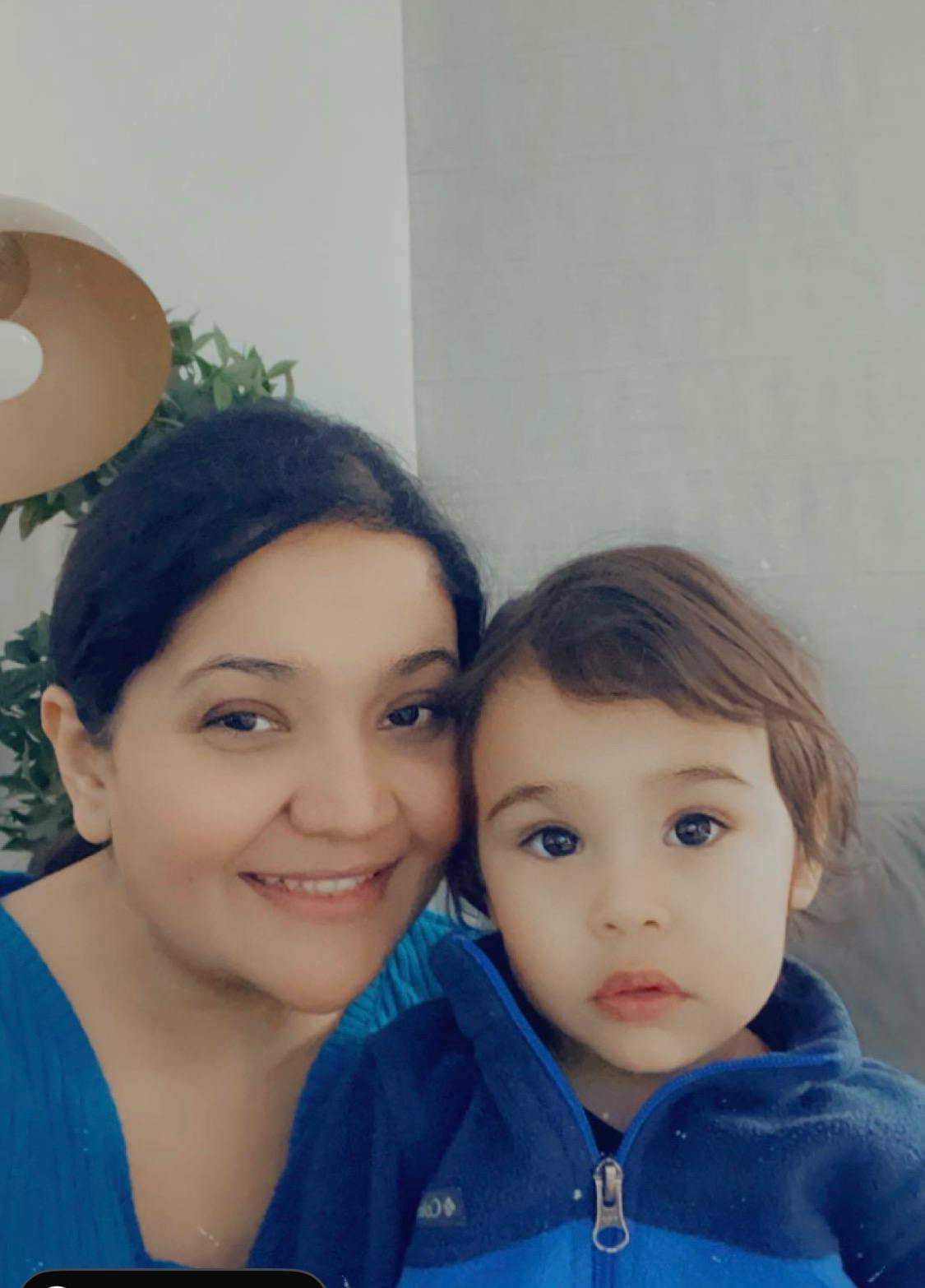 Adult and child posing for a photo together