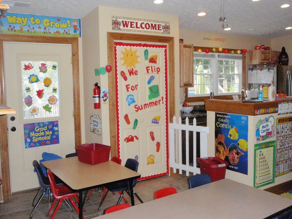 Classroom with decorated doors and small tables