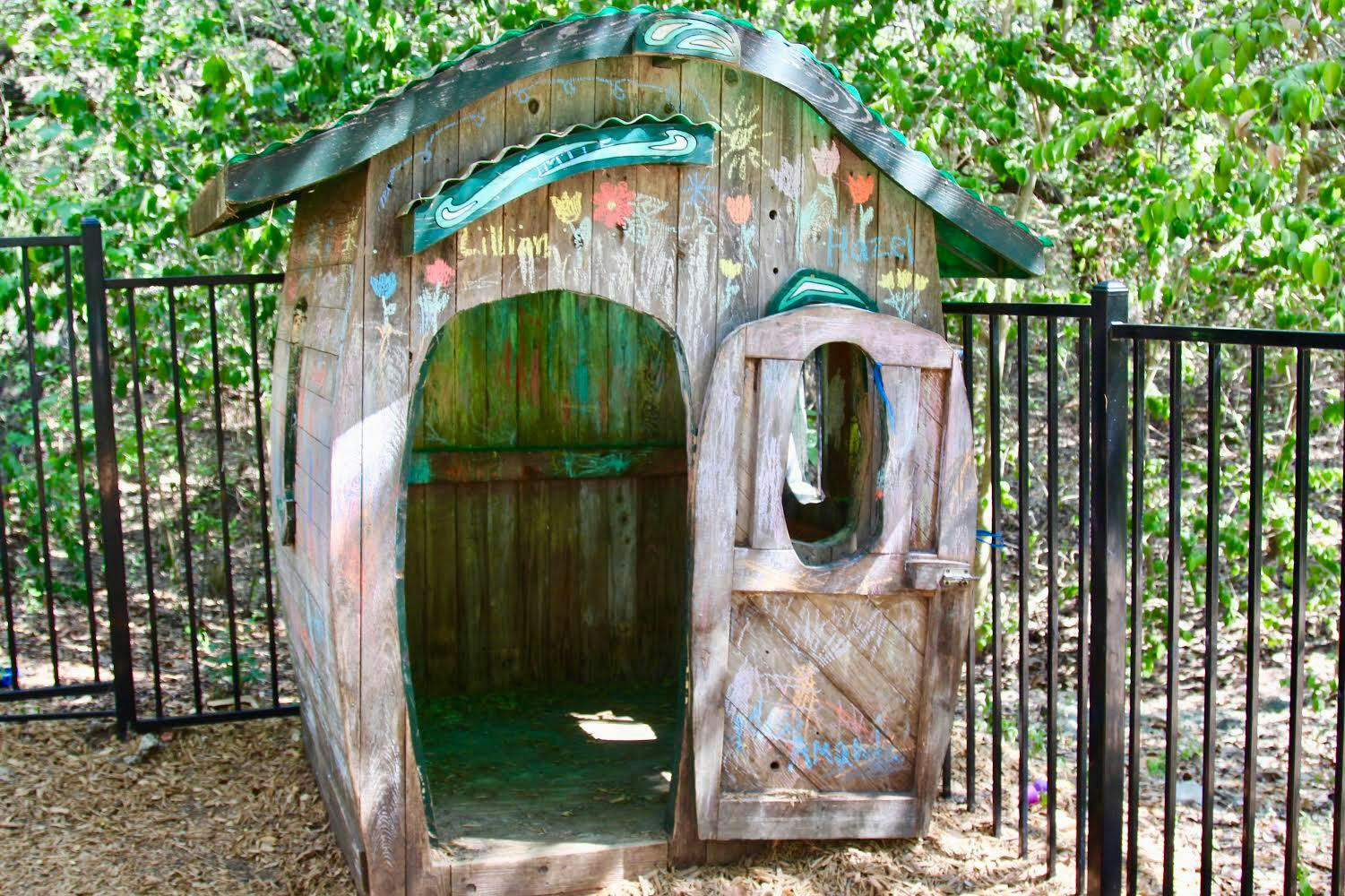 Wooden playhouse with an open door