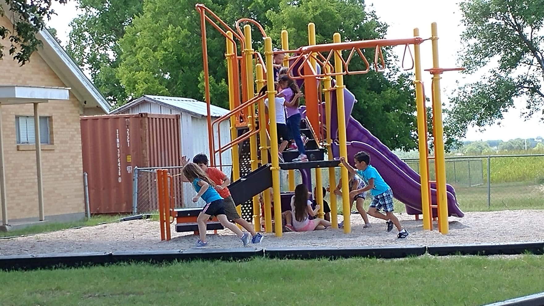 Children playing on a playground structure