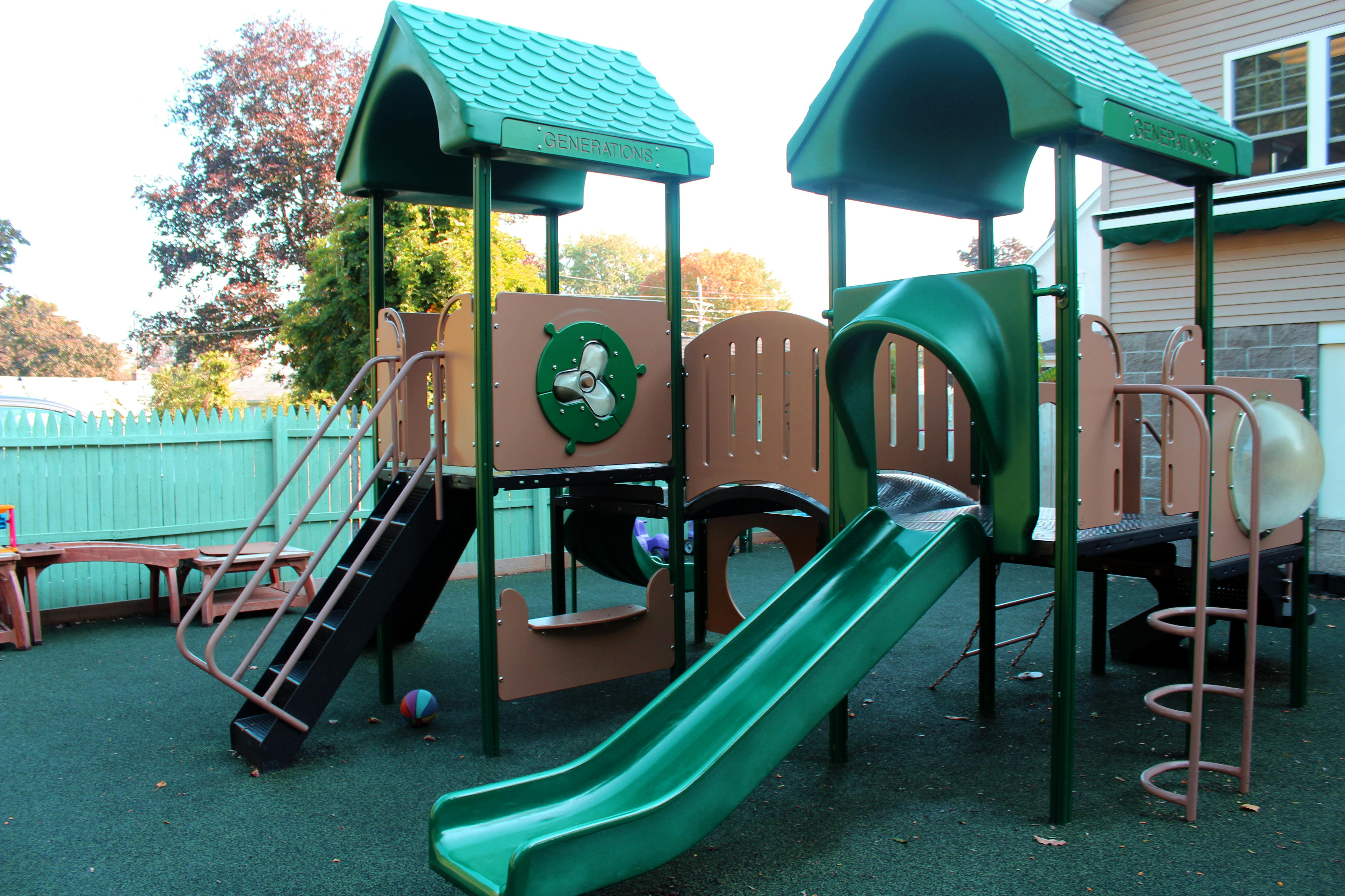 Playground structure with slides and climbing elements