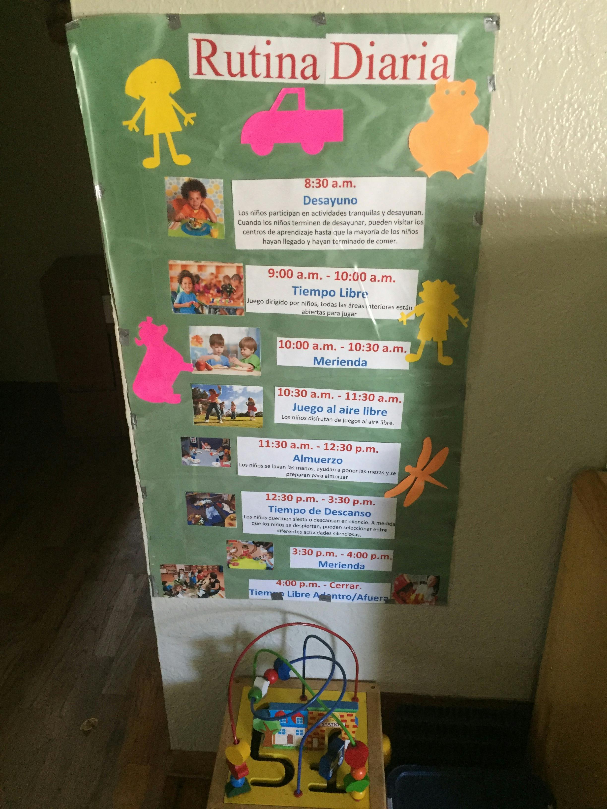 Daily routine chart with text and images, and a child's activity cube