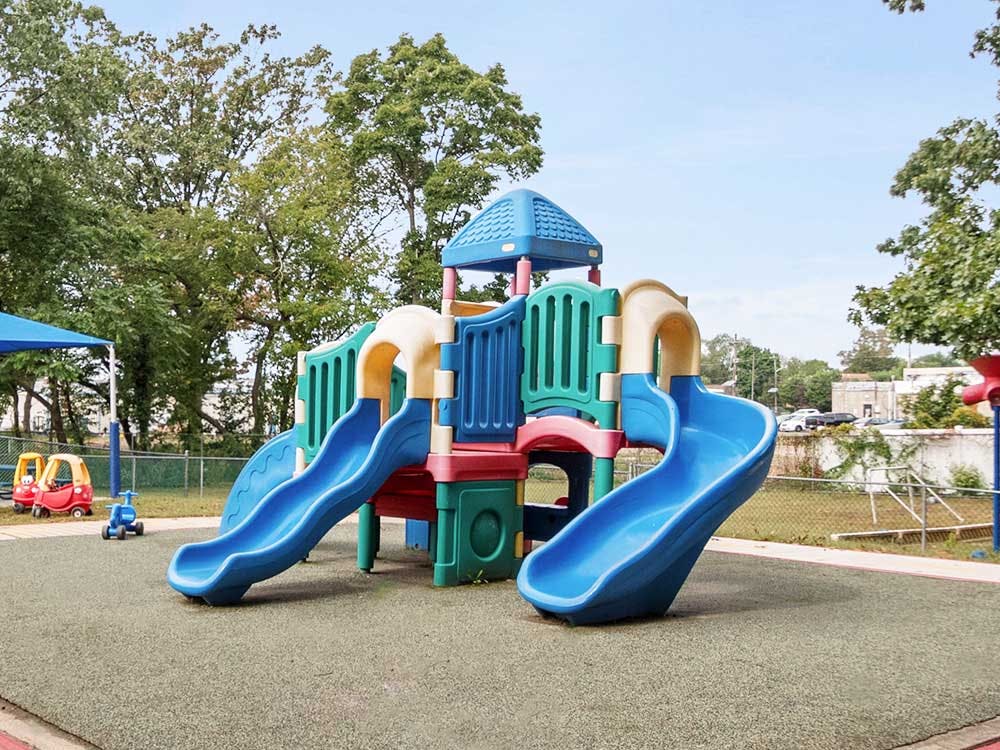Colorful playground with blue slides and red and yellow structures