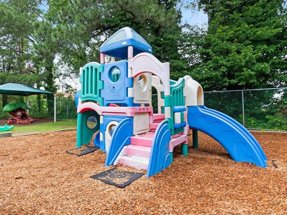 Colorful playground structure on wood chips