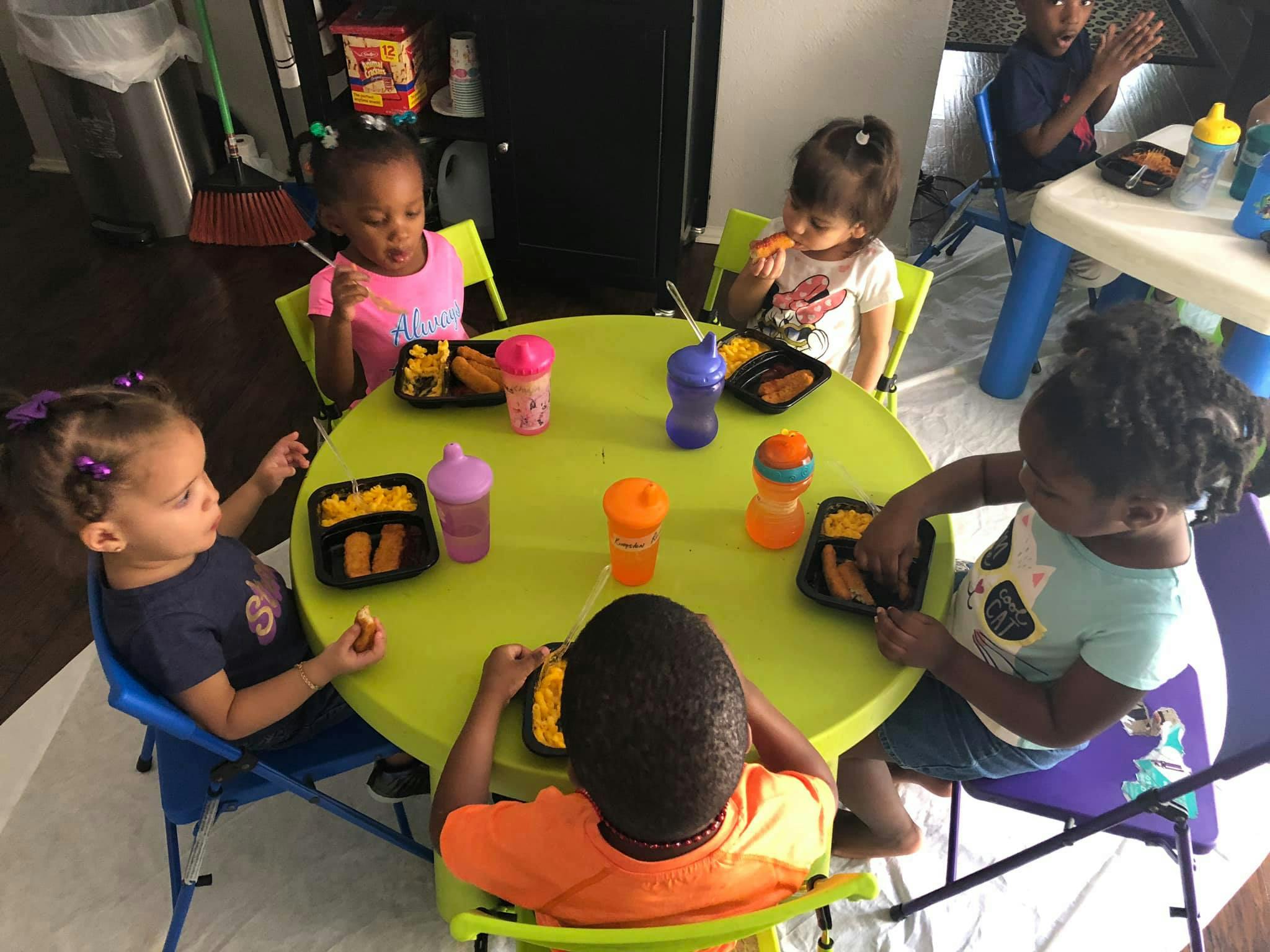 Children eating at a small round table