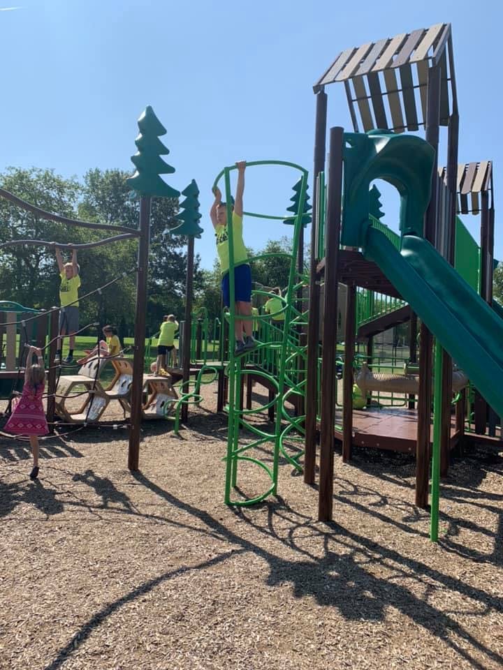 Children playing on a playground structure