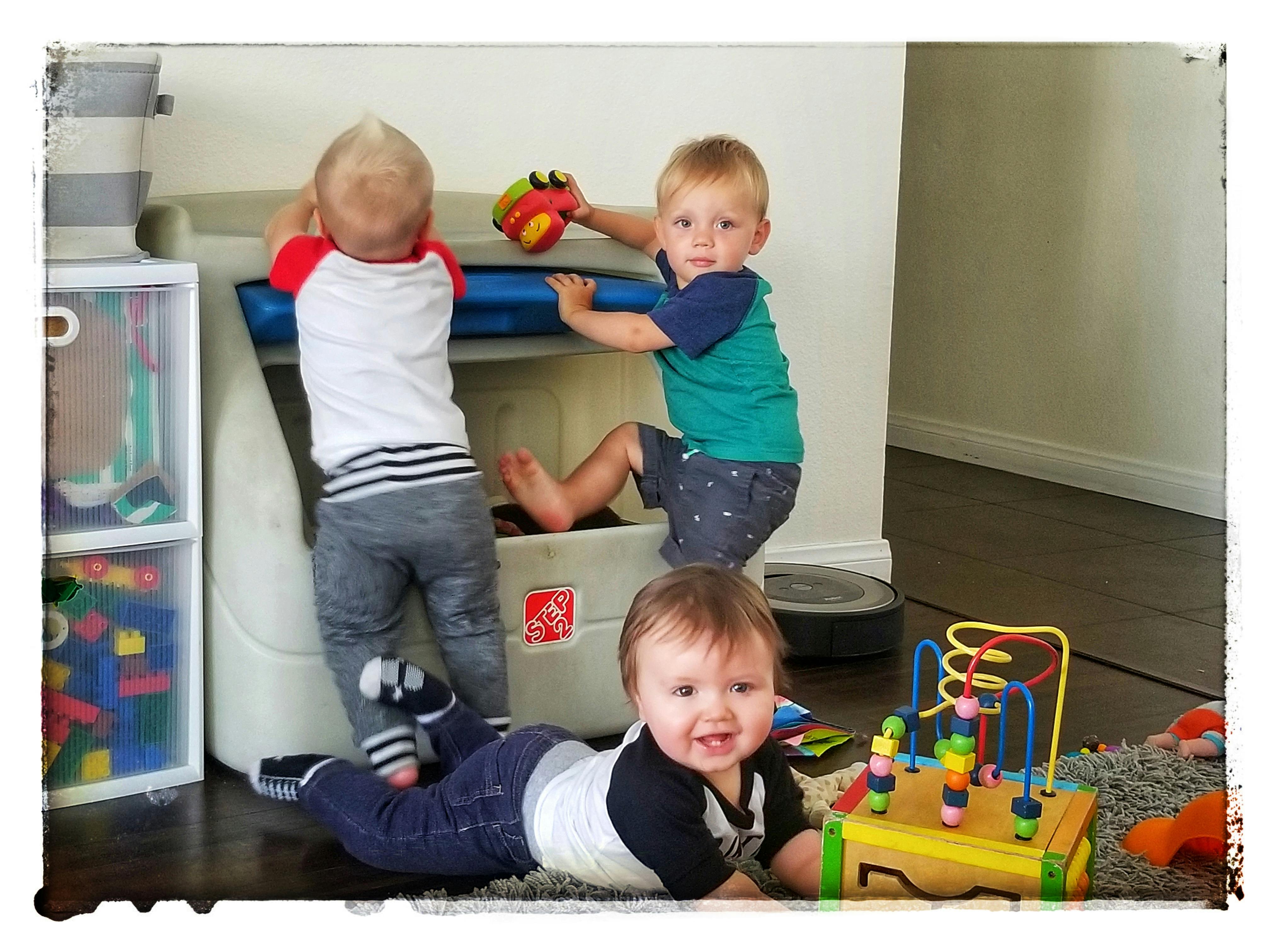 Three children playing with toys