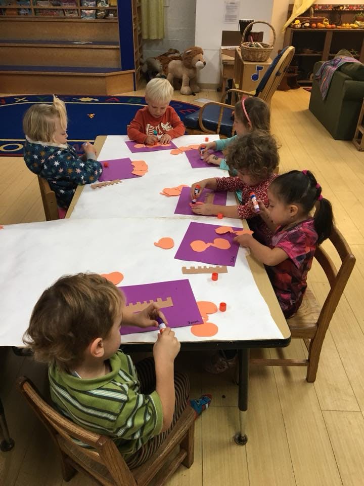 Children doing crafts at a table