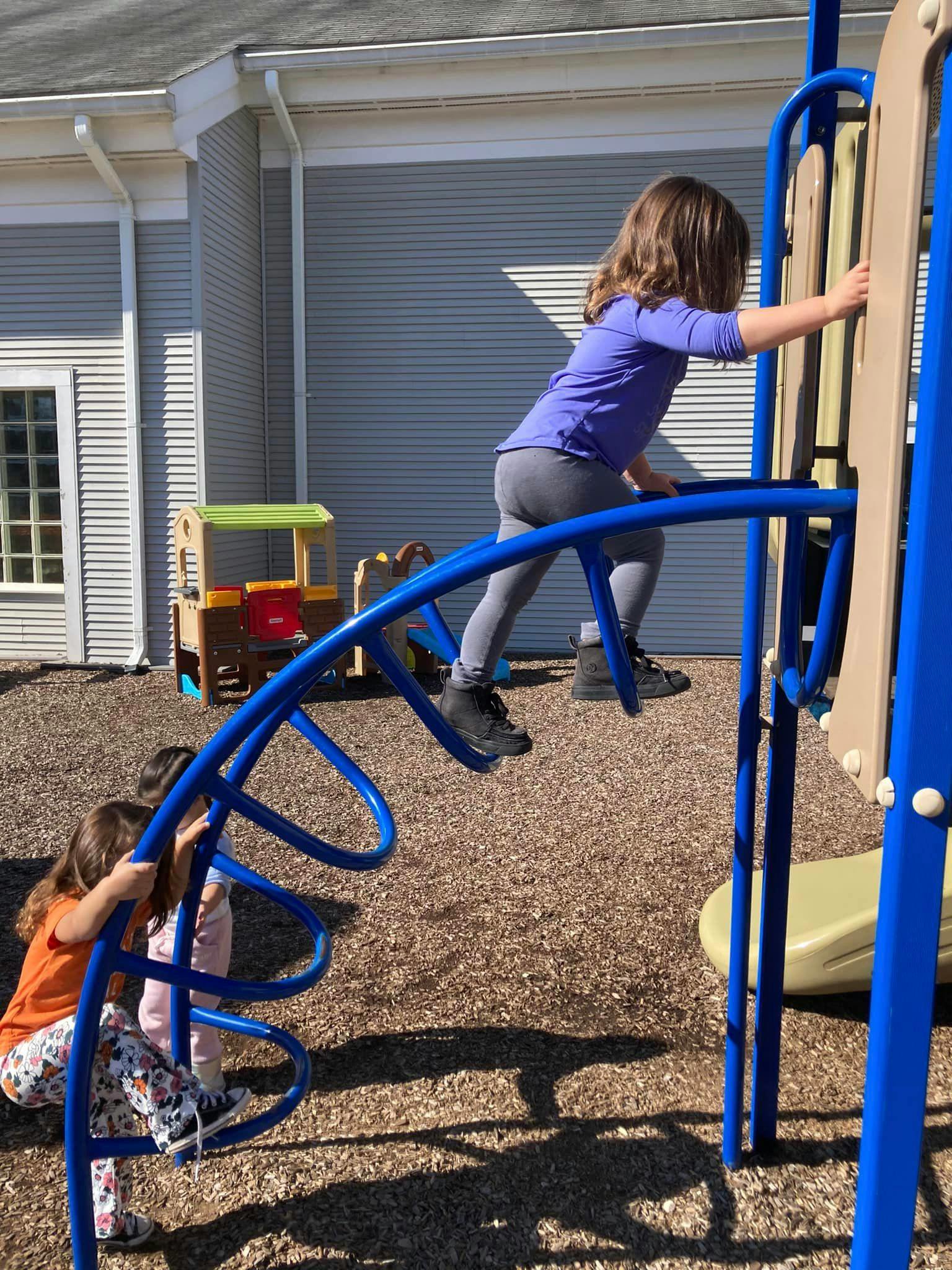 Children climbing on playground equipment