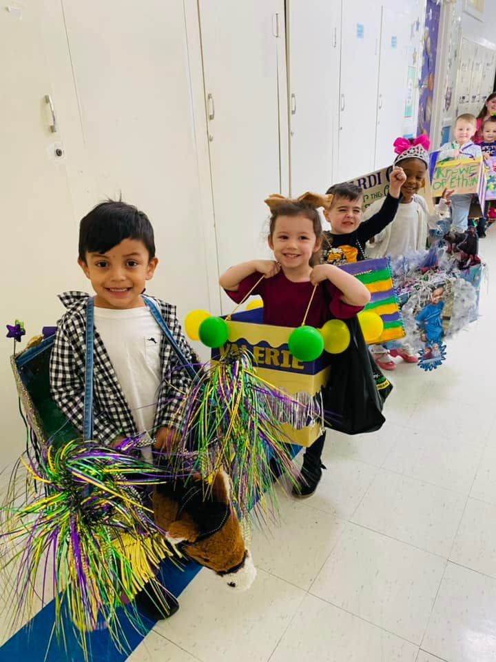 Children in costumes in a line
