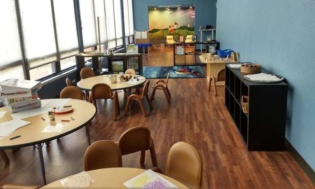Classroom with small tables and chairs