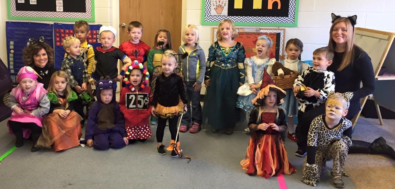 Group of children and adults in costumes
