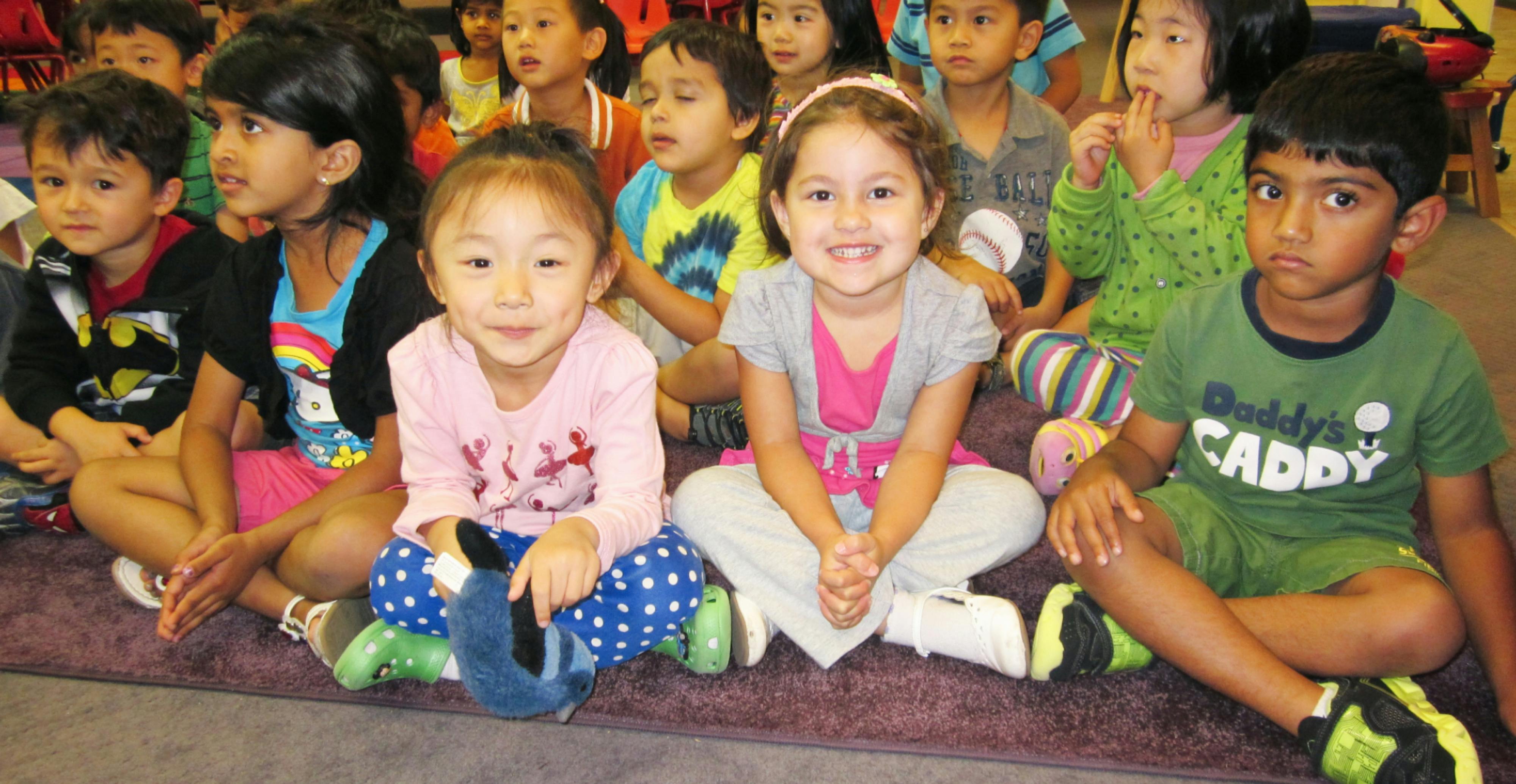 Group of children sitting on the floor