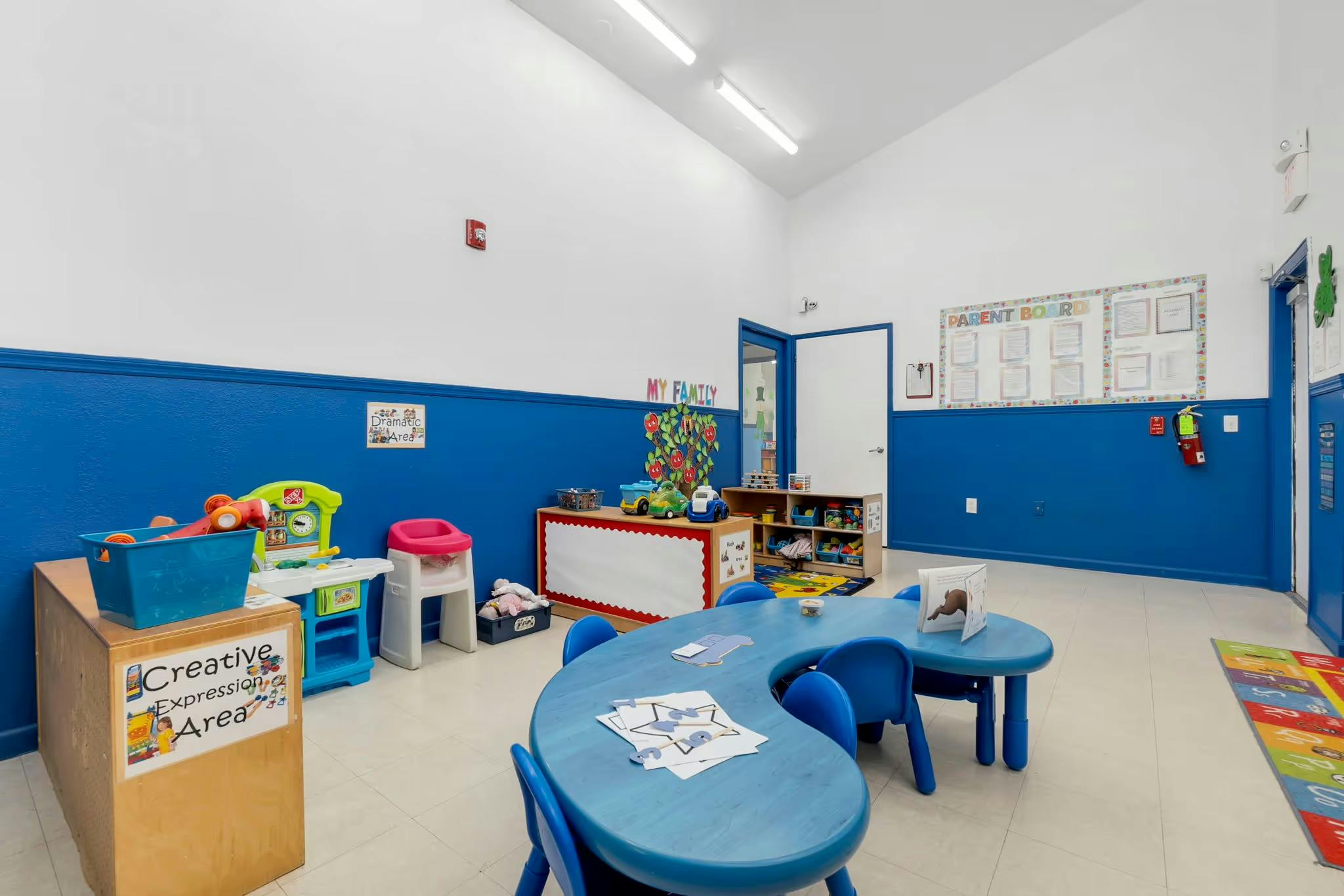 Children's classroom with blue tables and chairs