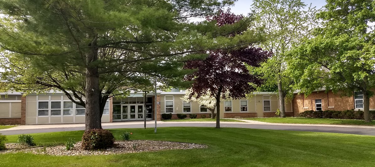 Building with many windows and trees in front