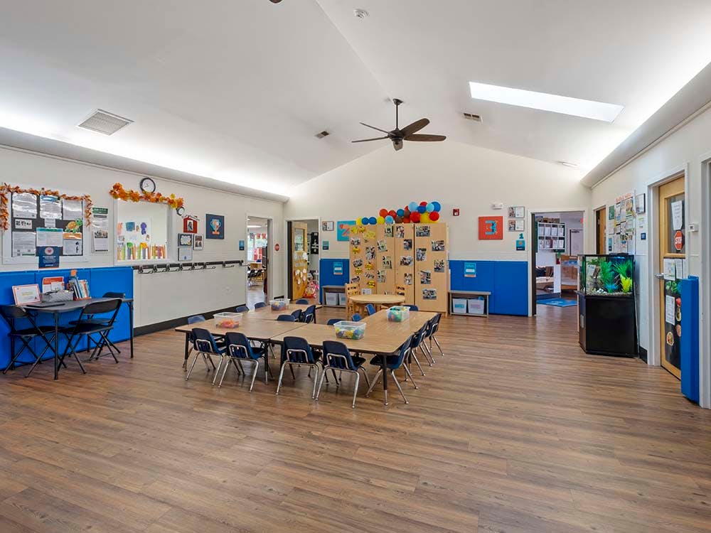 Empty classroom with tables and chairs