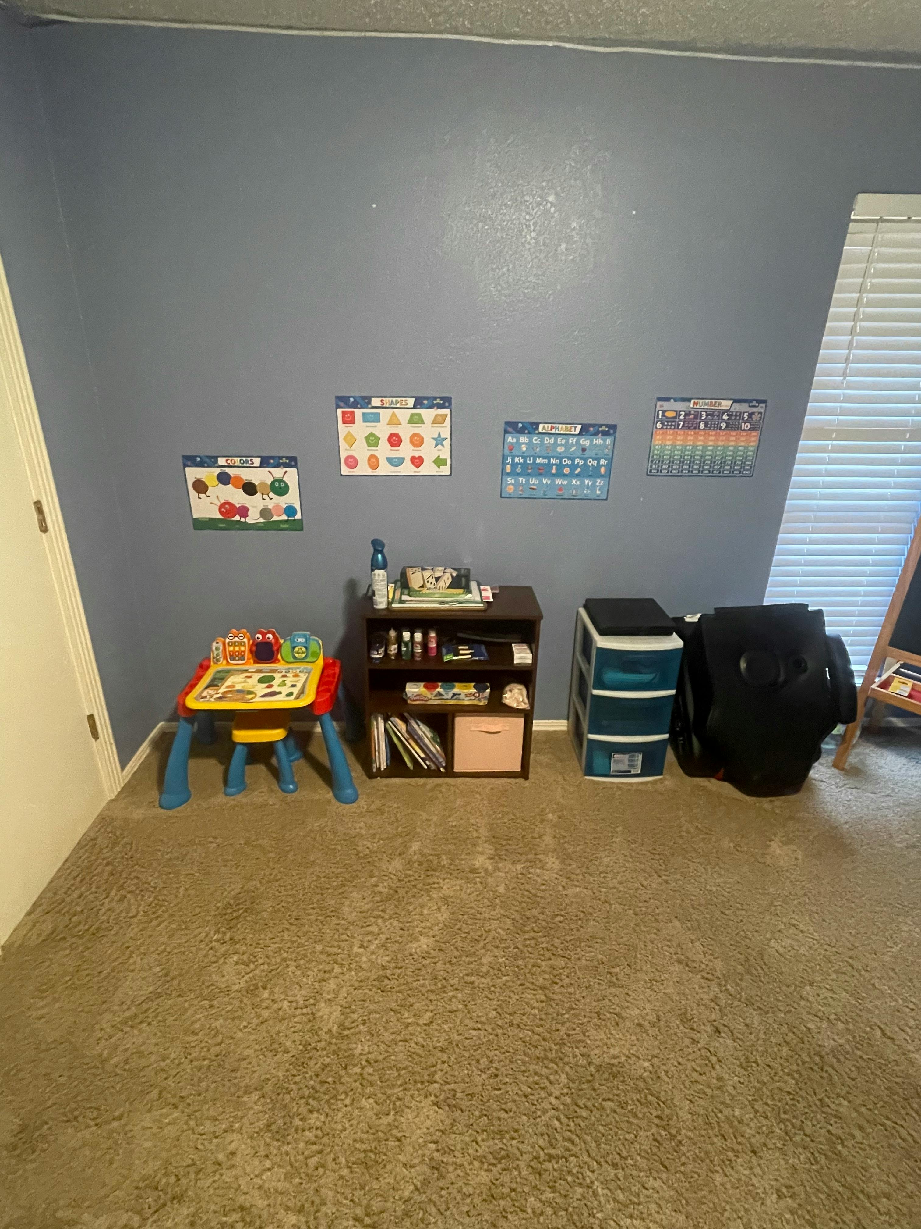 Children's play table and storage shelves in a room