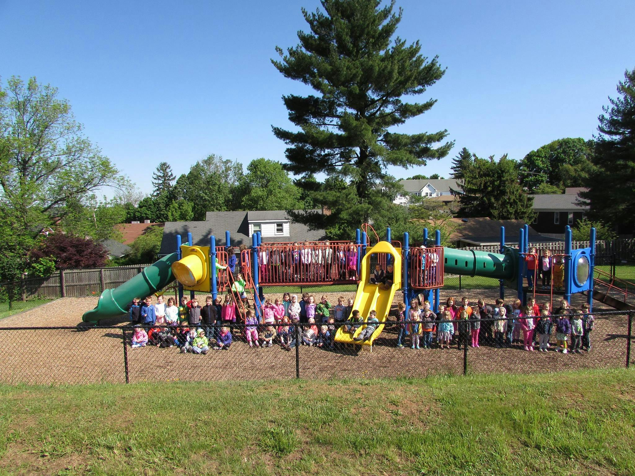 Group of children and teens on a playground structure