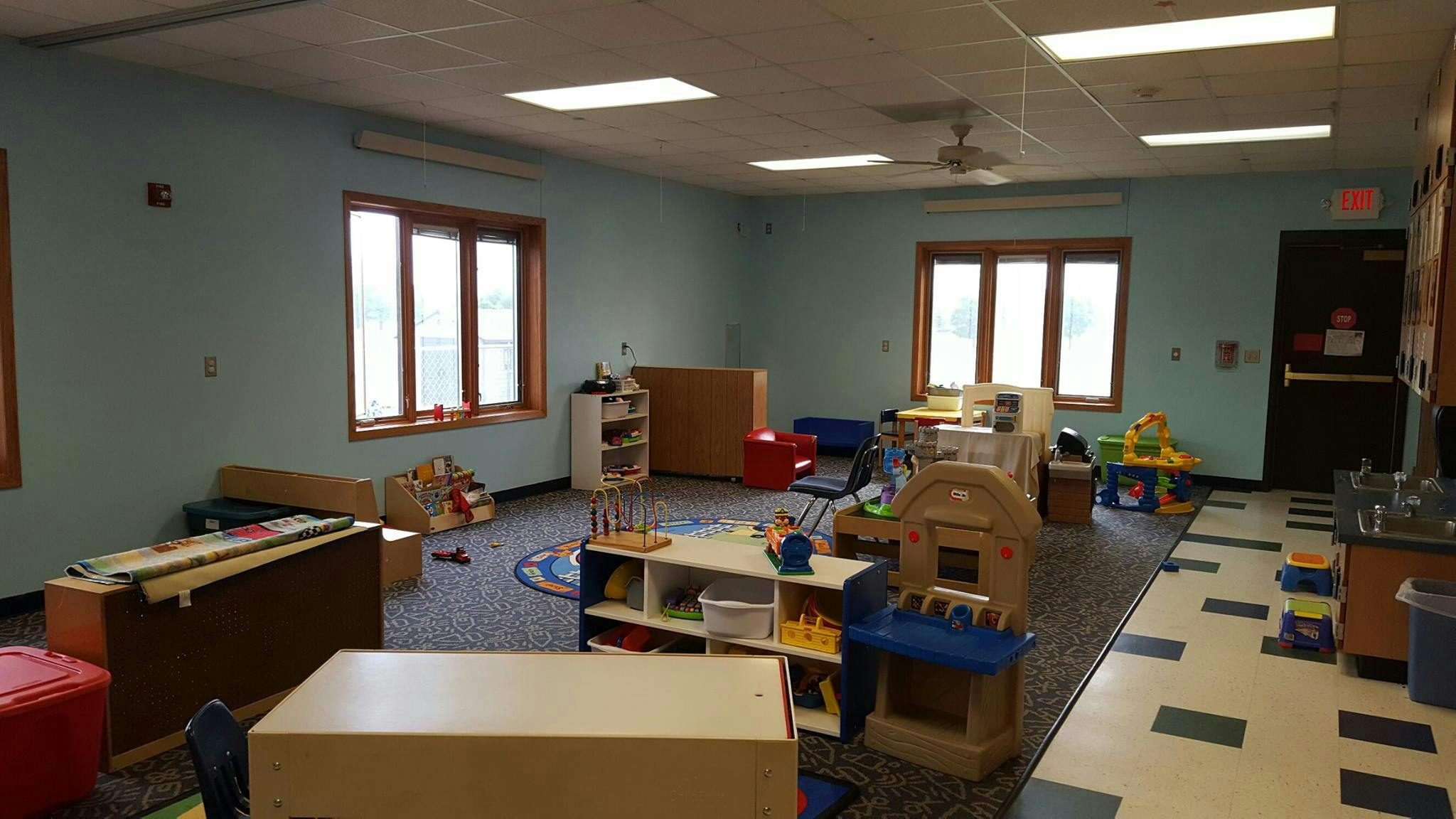 Empty classroom with various furniture and toys