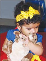 Child holding a stuffed animal