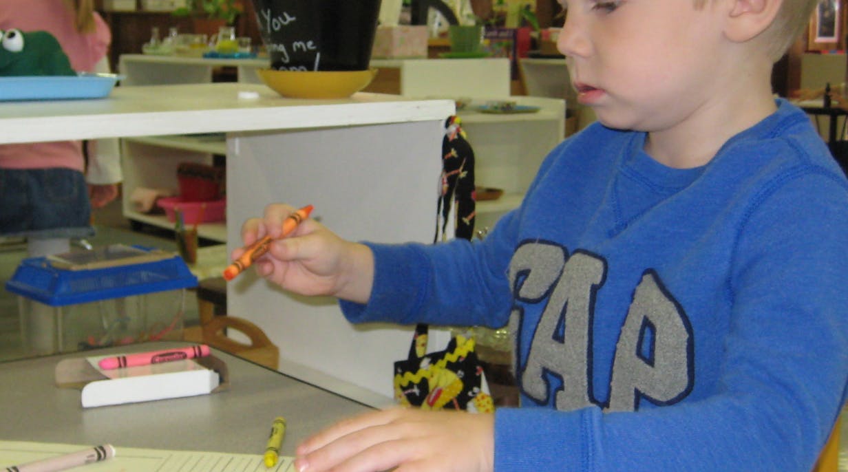 Child holding a crayon